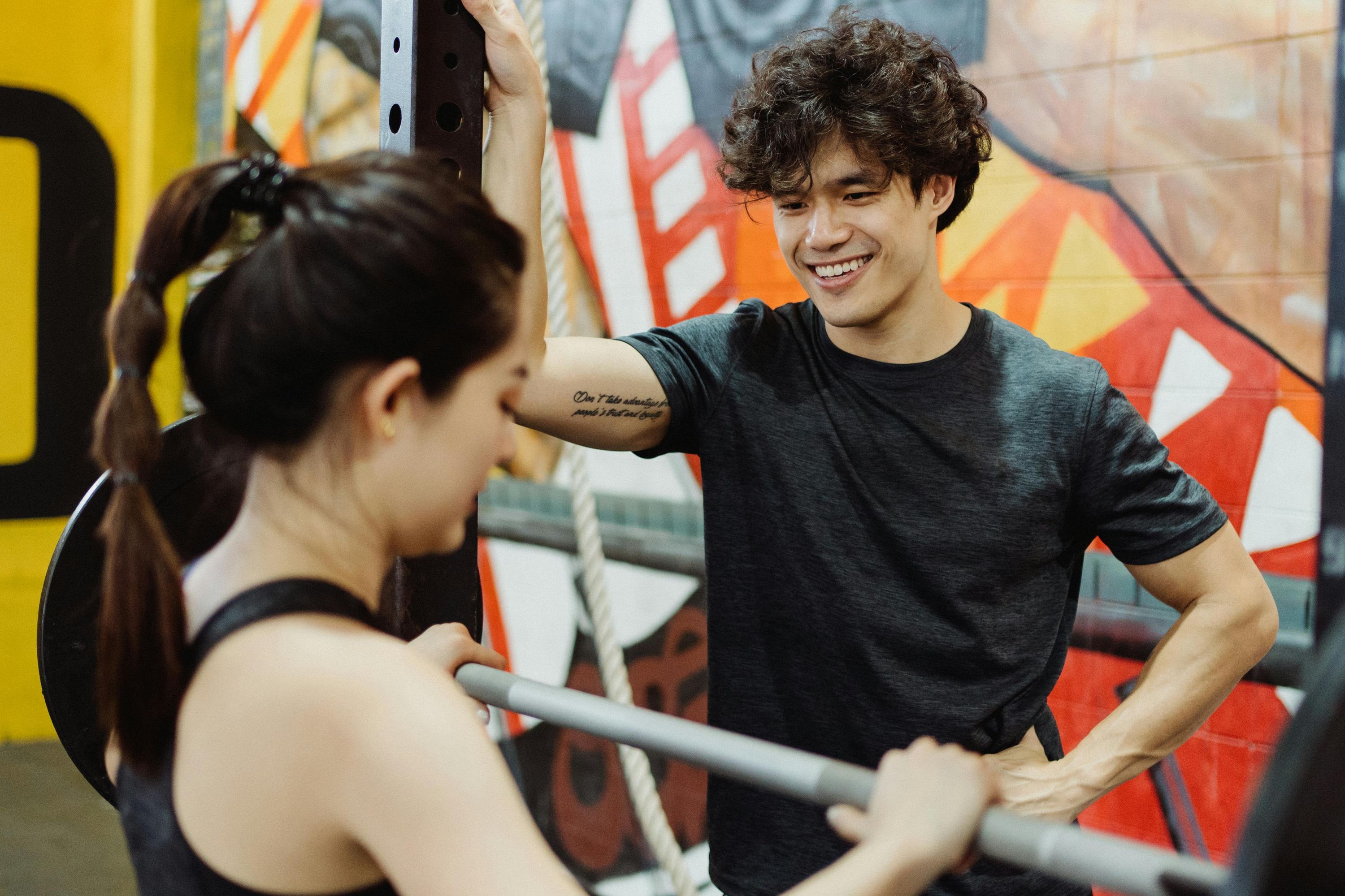 Personal trainer smiling with a client