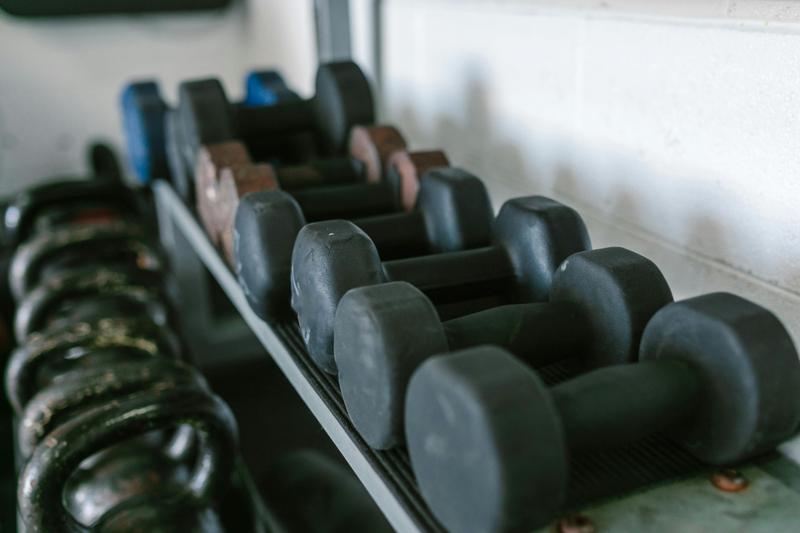 Rack of dumbbells and weights for resistance training